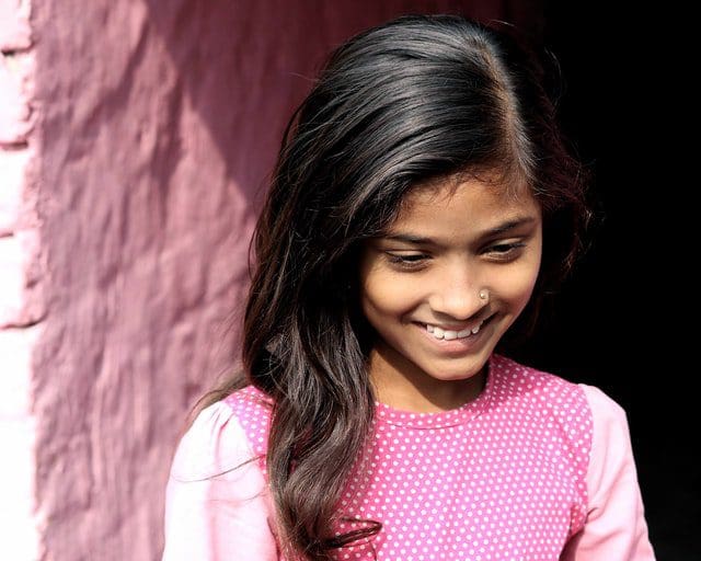 Girl smiles at inner perception