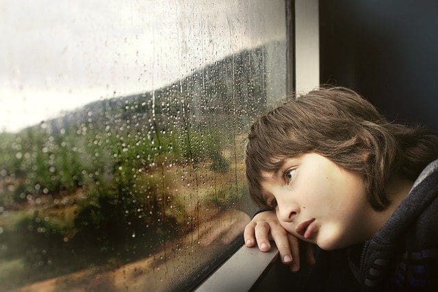 Bored young boy on train