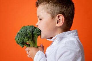Eating those veggies!